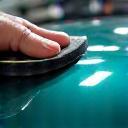 Applicator working on a ceramic-coated hood